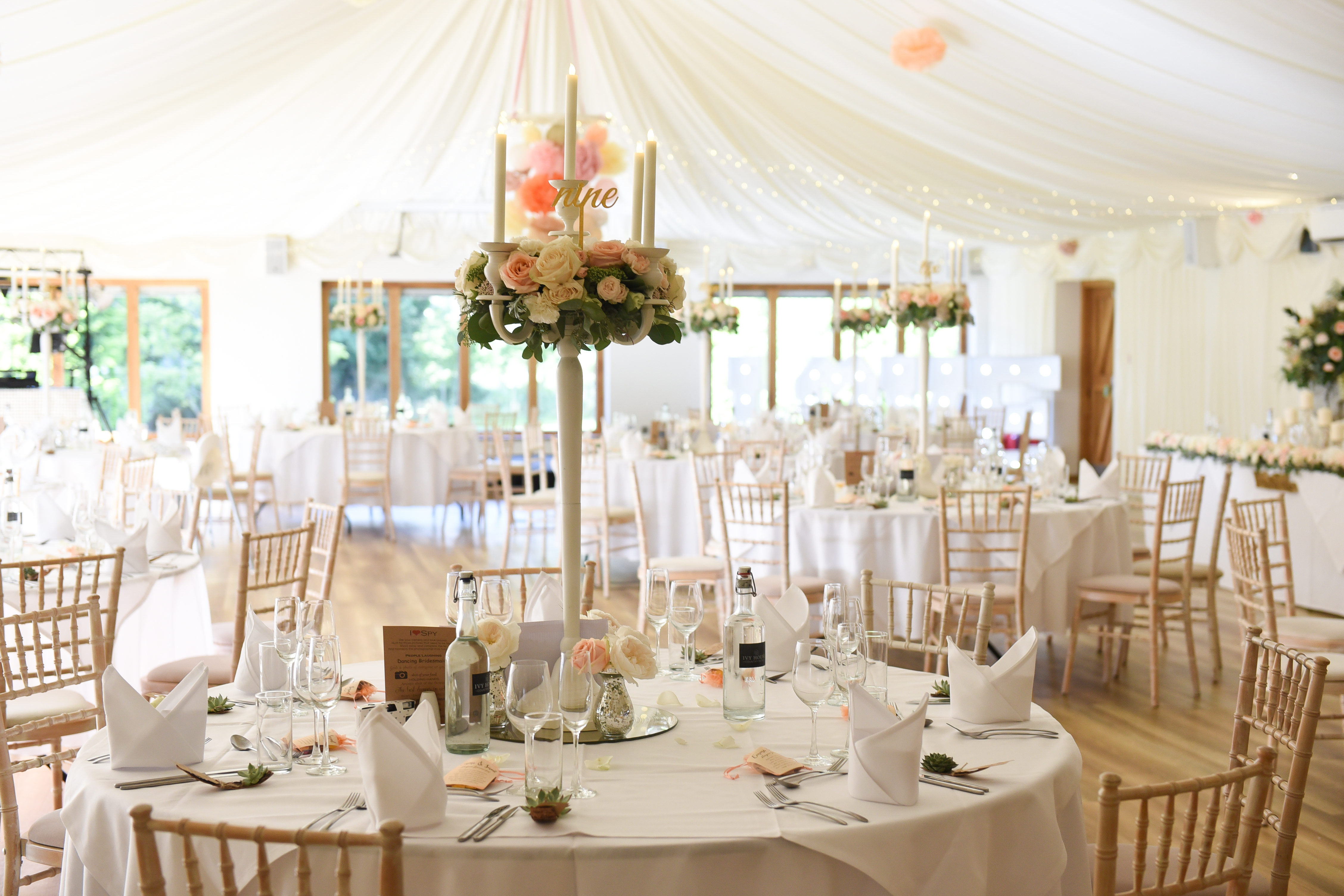 Wedding Guest Tables Decorated With White and Pink Roses and Candles at Ivy House Country Hotel